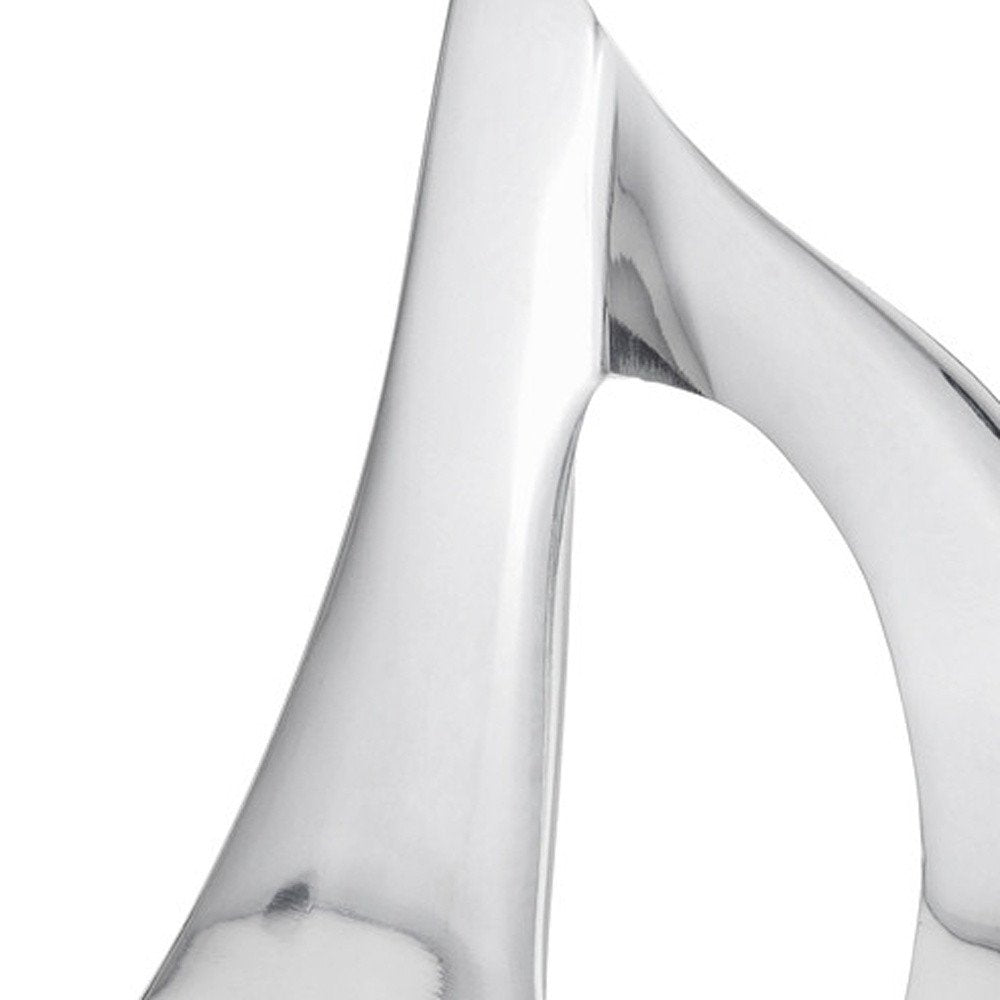 12" Brown and Silver Buffed Aluminum Sailboat Tabletop Sculpture. Sculpture isolated on a plain white background, finished in silver metal.