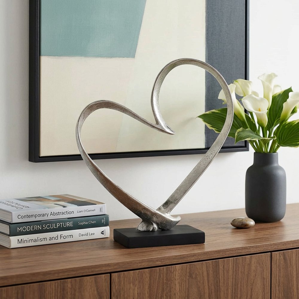 16" Raw Silver And Black Heart Sculpture. Sculpture in silver.