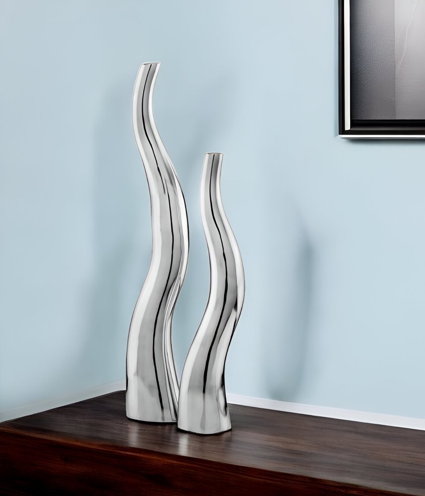 Set of Two Silver Aluminum Squiggly Vases in a home interior