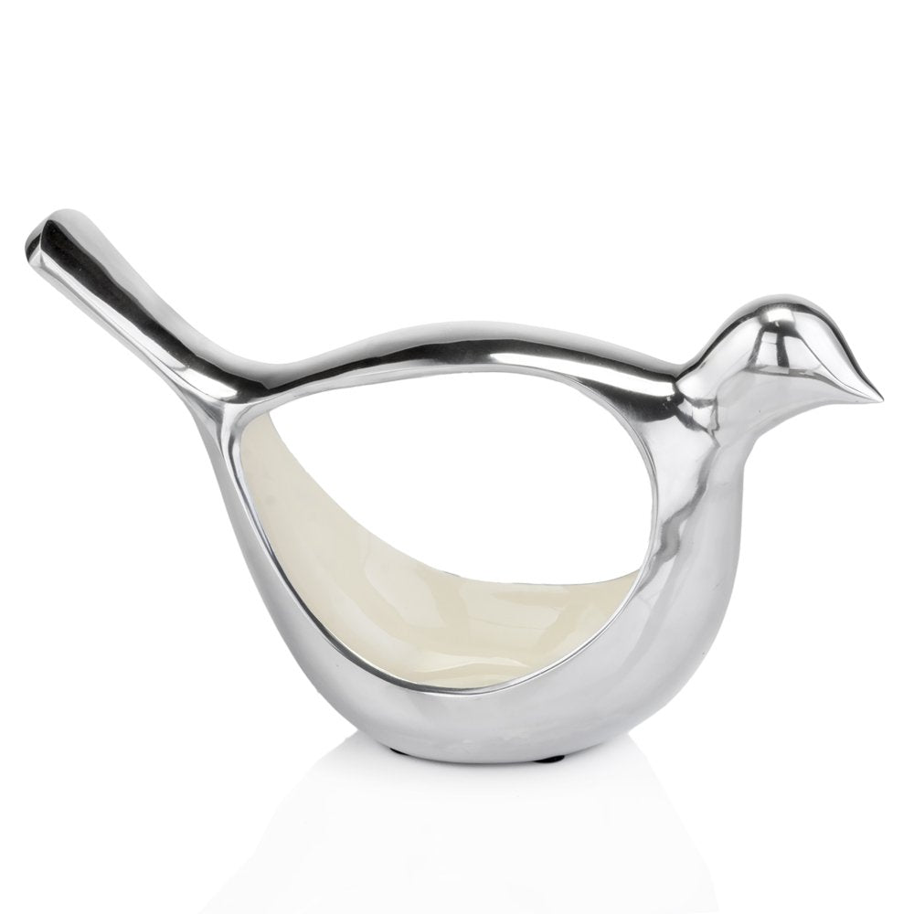 Silver buffed aluminum bird-shaped sculptural bowl with a cream interior, on a white background.