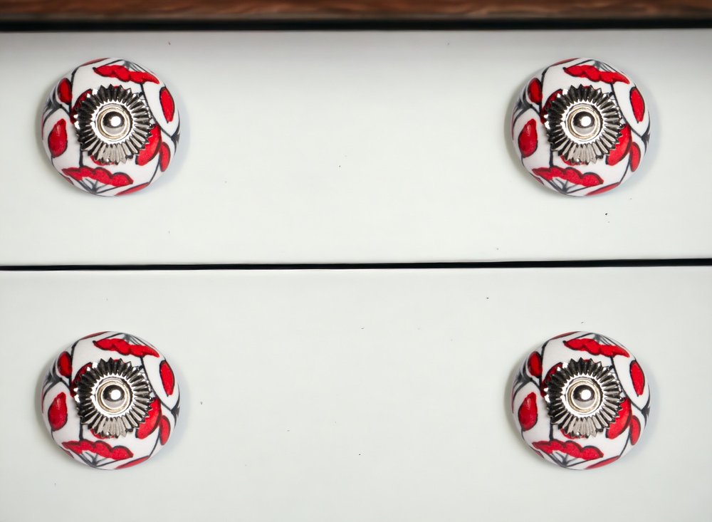 Set of Twelve Red And White Ceramic Drawer Pull Knobs in a home interior