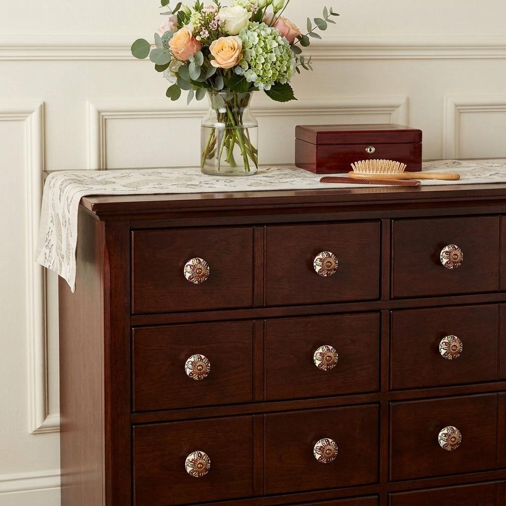 Set of Twelve Red And Yellow Botanical Ceramic Drawer Pull Knobs in a home interior