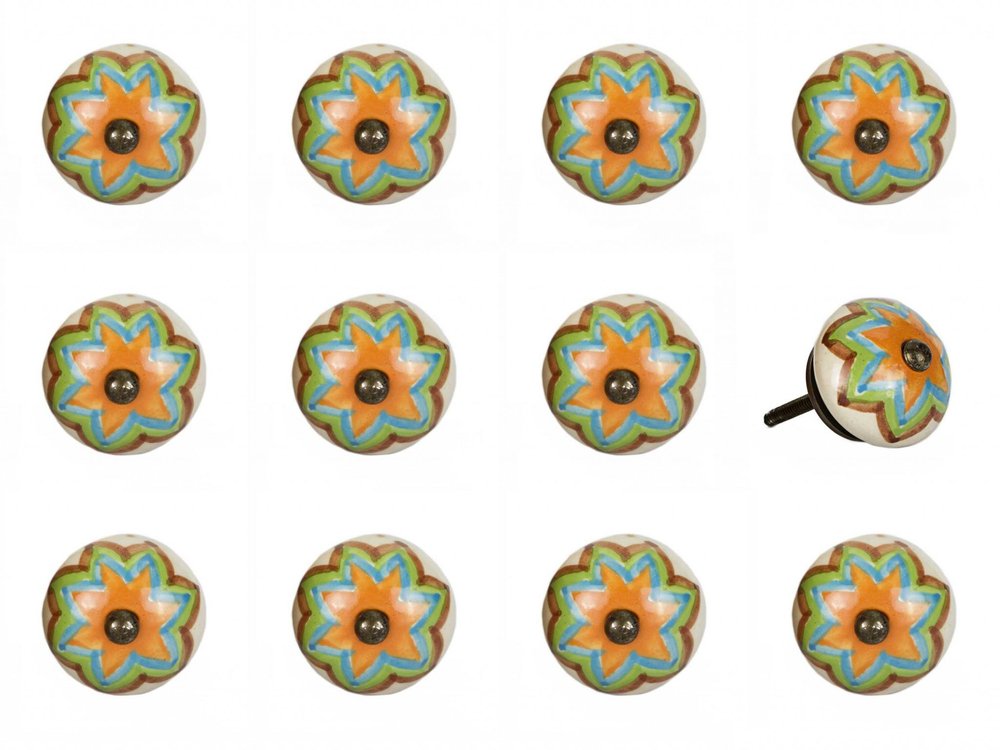 Twelve ceramic drawer knobs with a green, orange, and blue floral design on a white background.