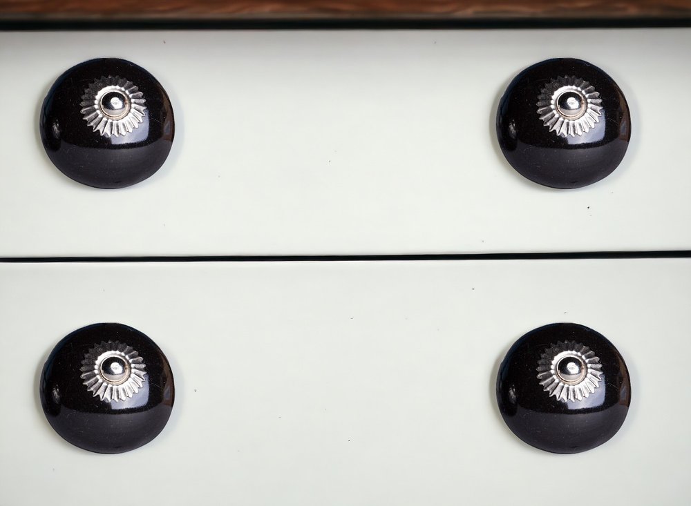 Set of Twelve Black Ceramic Drawer Pull Knobs in a home interior