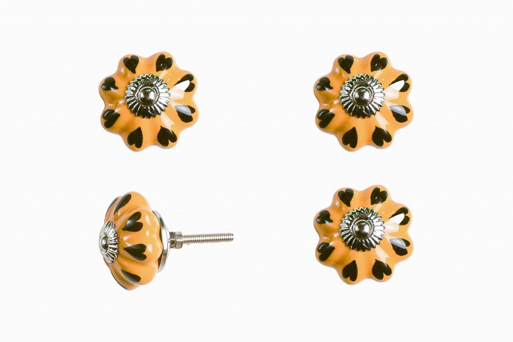 Set of Twelve Yellow And Green Ceramic Drawer Pull Knobs on a white background