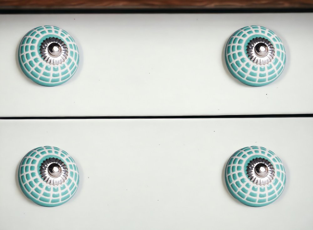 Set of Twelve Turquoise And White Geometric Ceramic Drawer Pull Knobs in a home interior