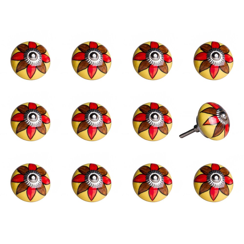 Twelve yellow ceramic drawer knobs with red and brown floral designs and silver centers on a white background.