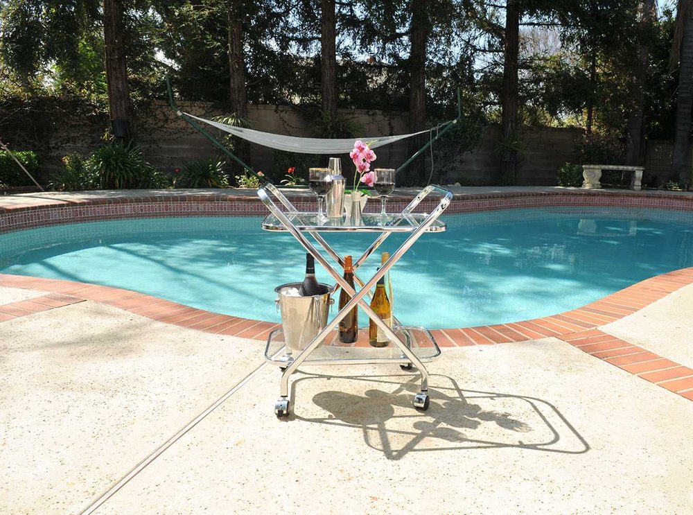 26" Silver Metal and Glass Rolling Bar Cart.