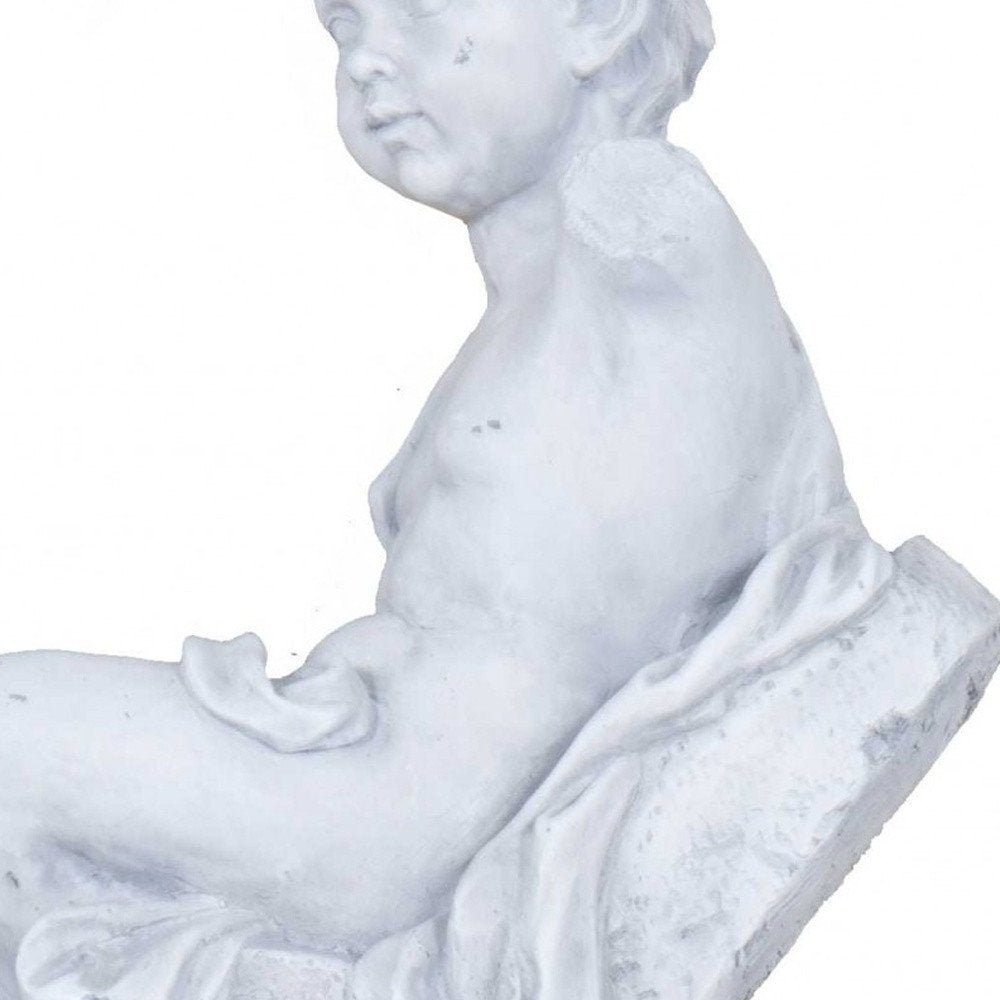 Vintage Look Off White Boy Sitting Statue on a white background