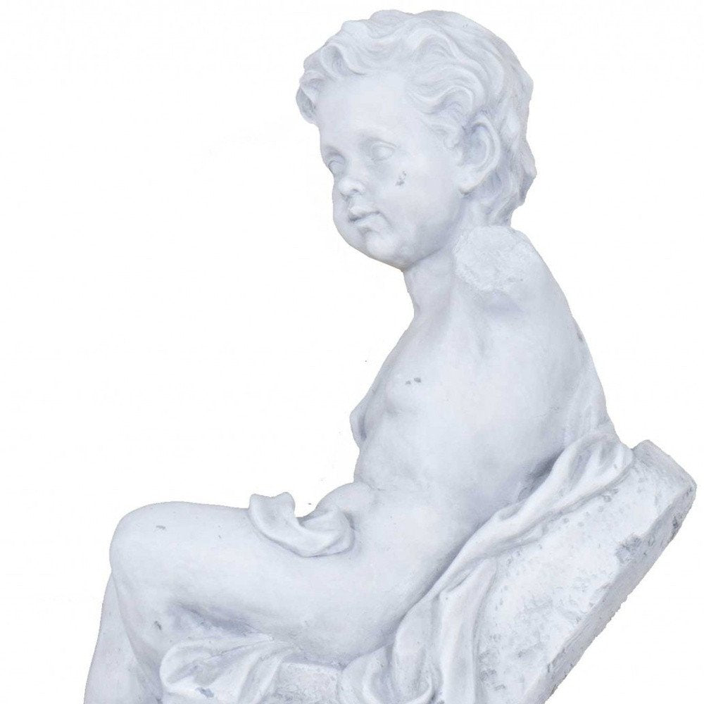 Vintage Look Off White Boy Sitting Statue on a white background