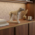 17" Natural Resin Hand Painted Figurine Tabletop Sculpture styled in a furnished interior with a dark brown wall on a dark wood floor in tan resin.