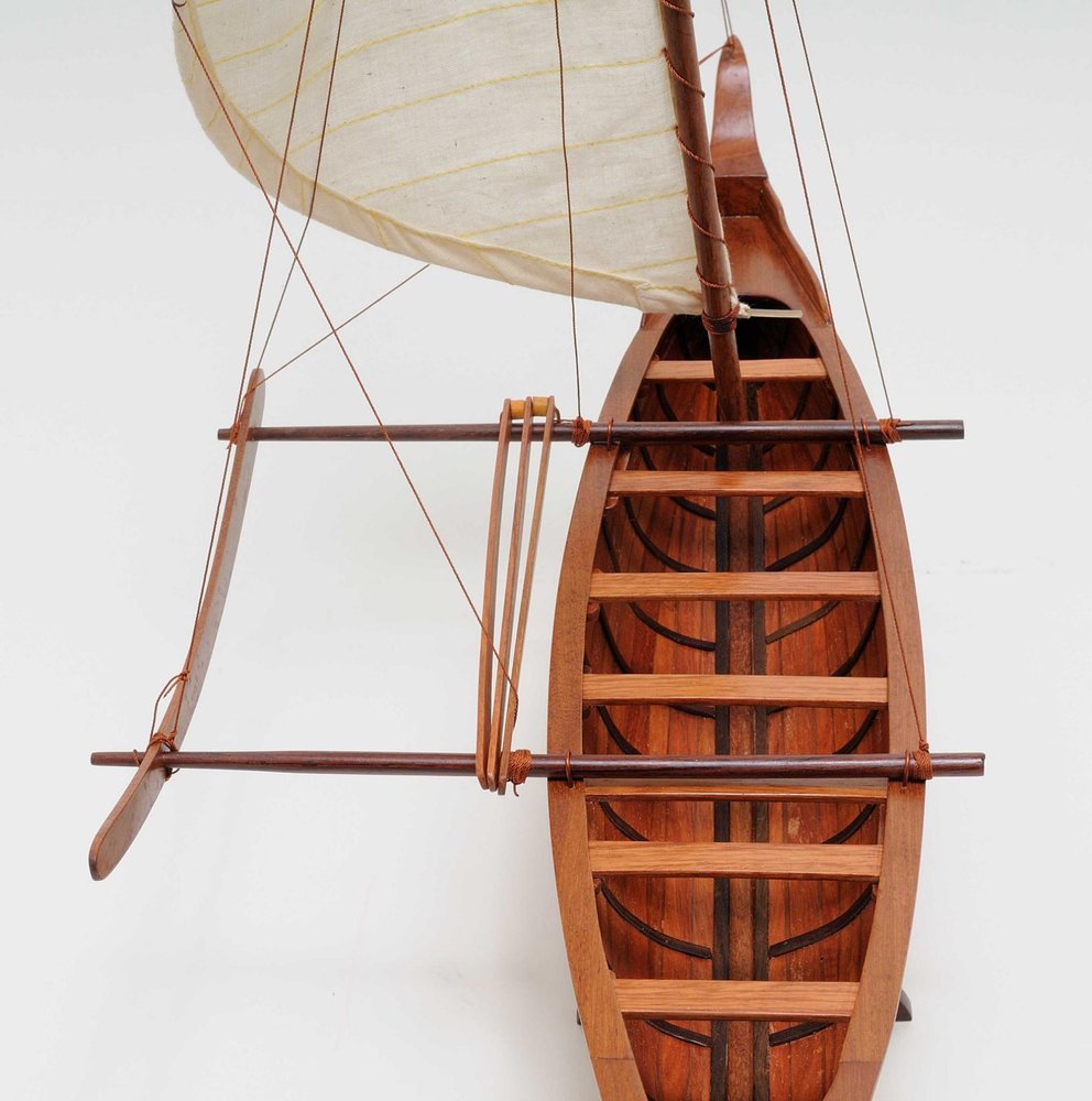 10" X 25.25" X 24" Hawaiian Canoe. Home product isolated on a plain white background, finished in burgundy.