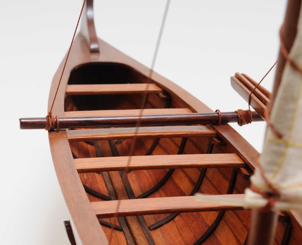 10" X 25.25" X 24" Hawaiian Canoe. Home product in burgundy.