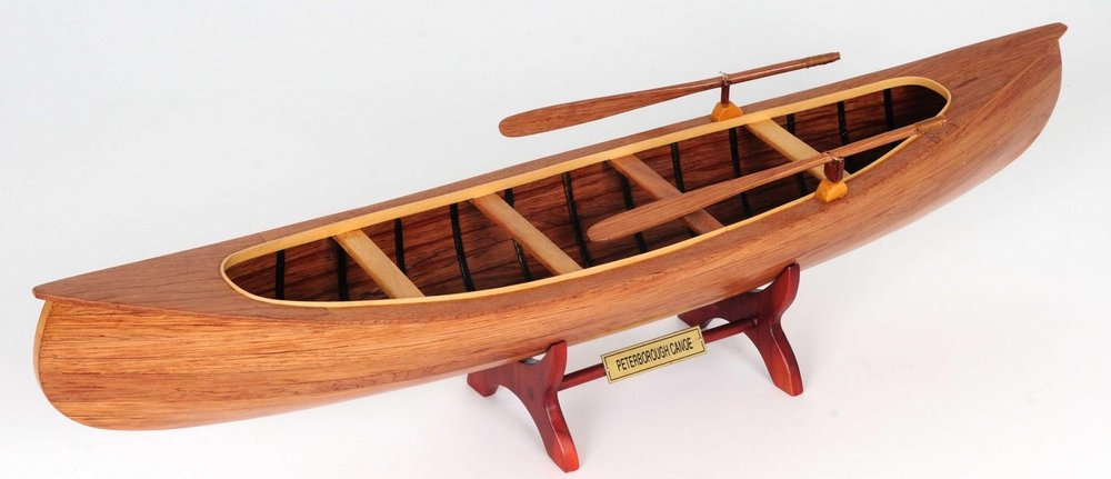 6" Wood Brown Solid Wood Hand Painted Model Boat Tabletop Sculpture. Sculpture isolated on a plain white background, in a brown wood finish.