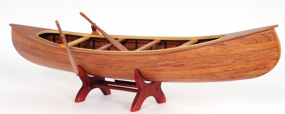 6" Wood Brown Solid Wood Hand Painted Model Boat Tabletop Sculpture. Sculpture isolated on a plain white background, showing a brown wood surface.
