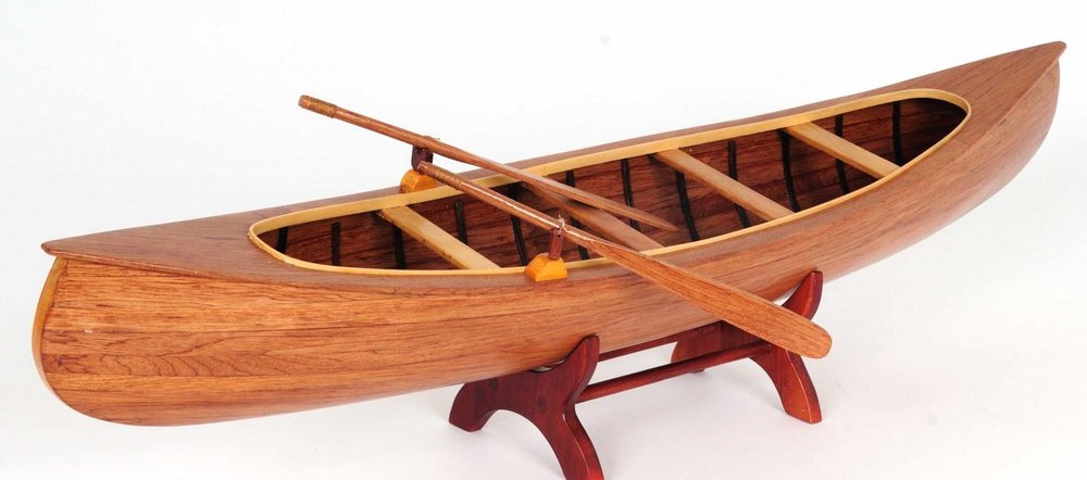 6" Wood Brown Solid Wood Hand Painted Model Boat Tabletop Sculpture. Sculpture isolated on a plain white background, showing a brown wood surface.
