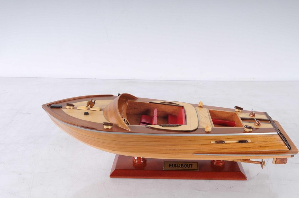 16" Brown Solid Wood Hand Painted Runabout Canoe Model Boat. Home product isolated on a plain white background, finished in brown wood.