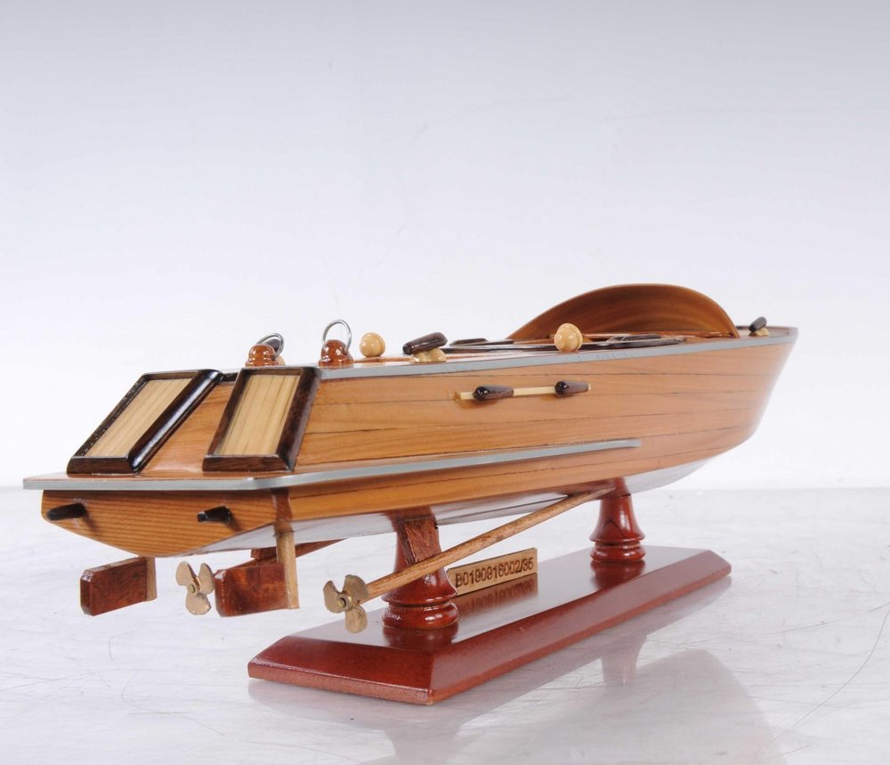 16" Brown Solid Wood Hand Painted Runabout Canoe Model Boat. Home product isolated on a plain white background, finished in brown wood.