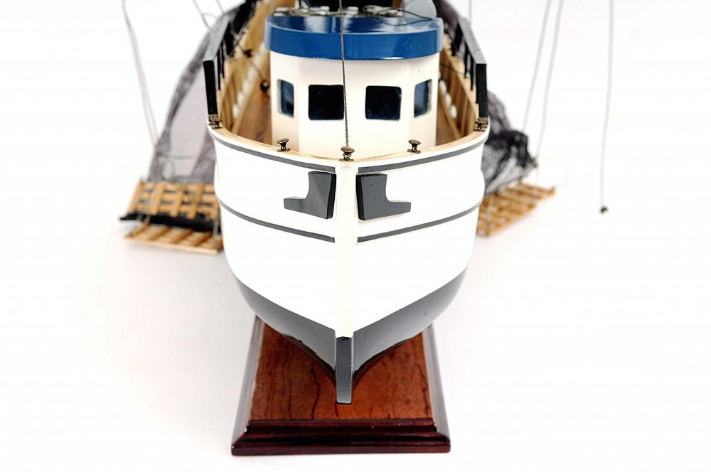 22" Black And White Solid Wood Hand Painted Model Boat. Home product isolated on a plain white background, in a white wood finish.