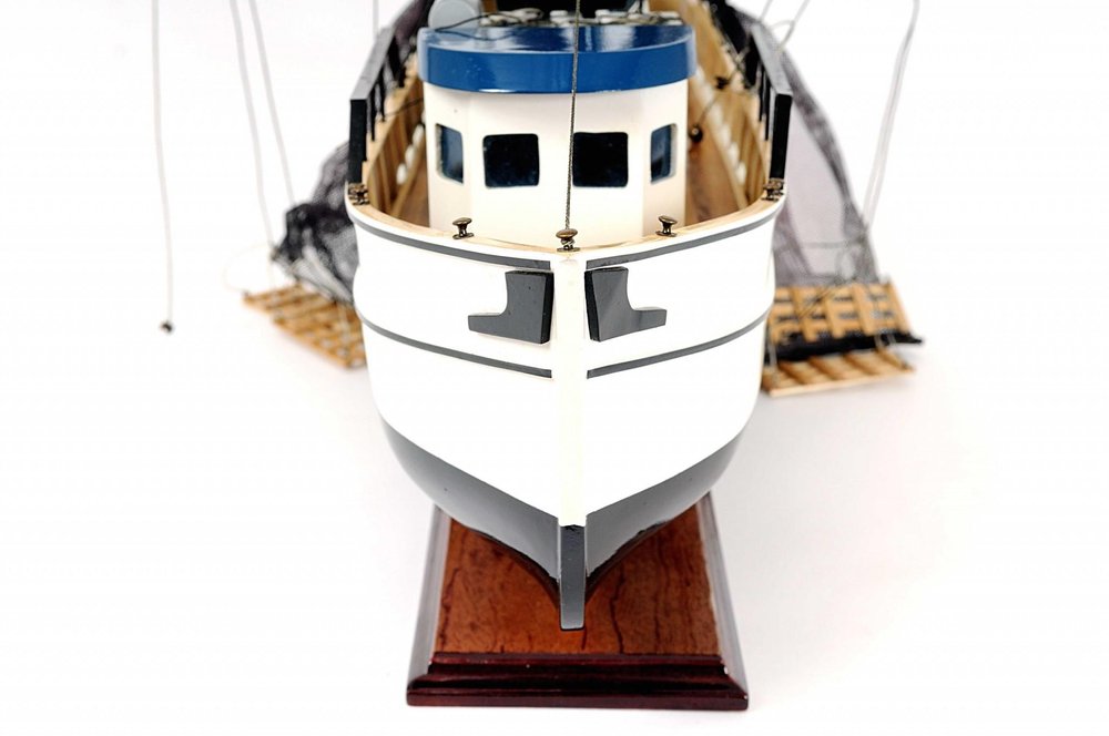 22" Black And White Solid Wood Hand Painted Model Boat. Home product isolated on a plain white background, finished in white wood.