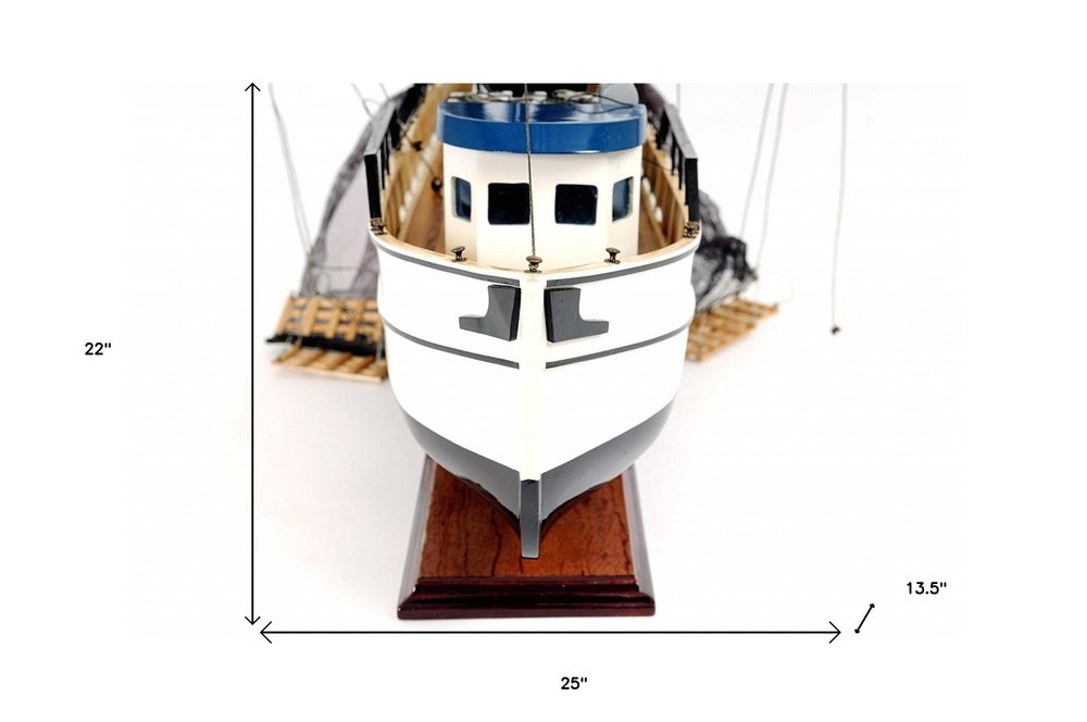 22" Black And White Solid Wood Hand Painted Model Boat. Home product isolated on a plain white background, finished in white wood.