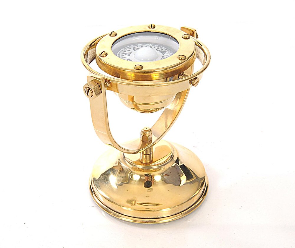 4.5" X 5" X 5.5" Gimbaled Compass. Sculpture isolated on a plain white background, showing a gold metal surface.