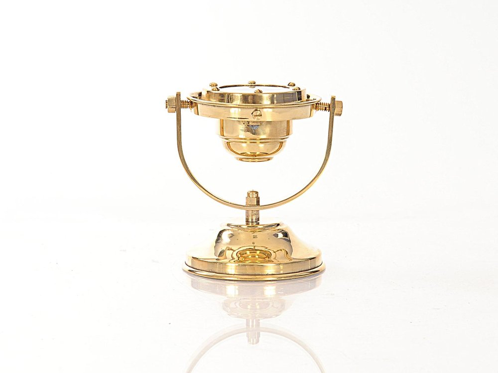 4.5" X 5" X 5.5" Gimbaled Compass. Sculpture isolated on a plain white background, in a gold metal finish.