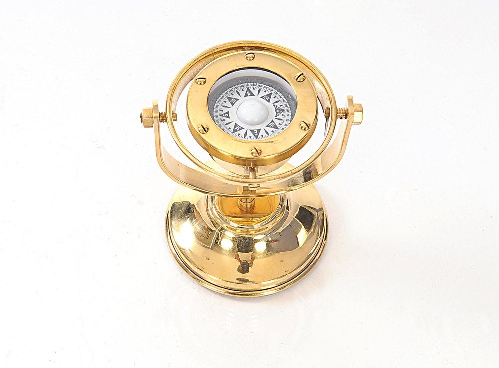 4.5" X 5" X 5.5" Gimbaled Compass. Sculpture isolated on a plain white background, showing a gold metal surface.