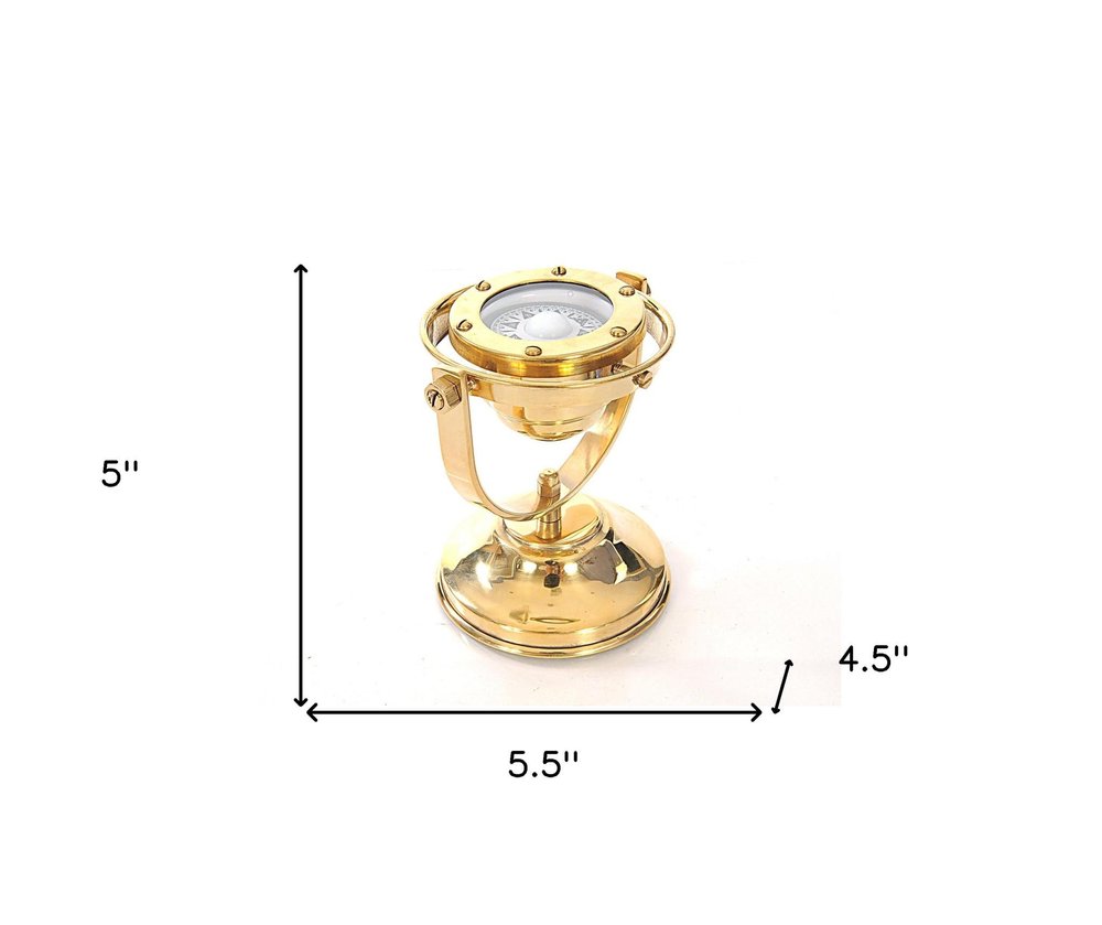 4.5" X 5" X 5.5" Gimbaled Compass. Sculpture isolated on a plain white background, finished in gold metal.