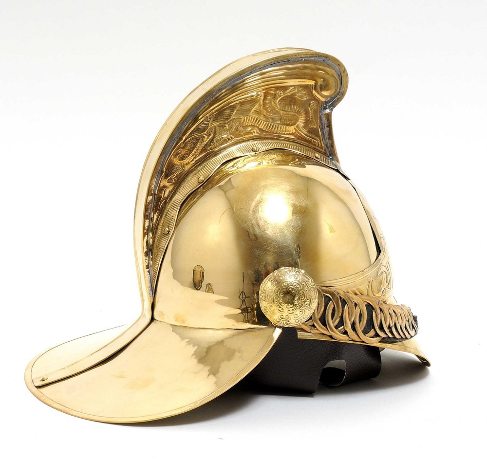 10" X 12" X 11" Fireman Helmet. Home product isolated on a plain white background, showing its tan color.