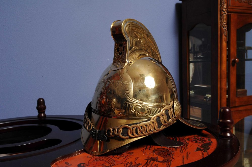 10" X 12" X 11" Fireman Helmet shown outdoors on an outdoor setting in blue.