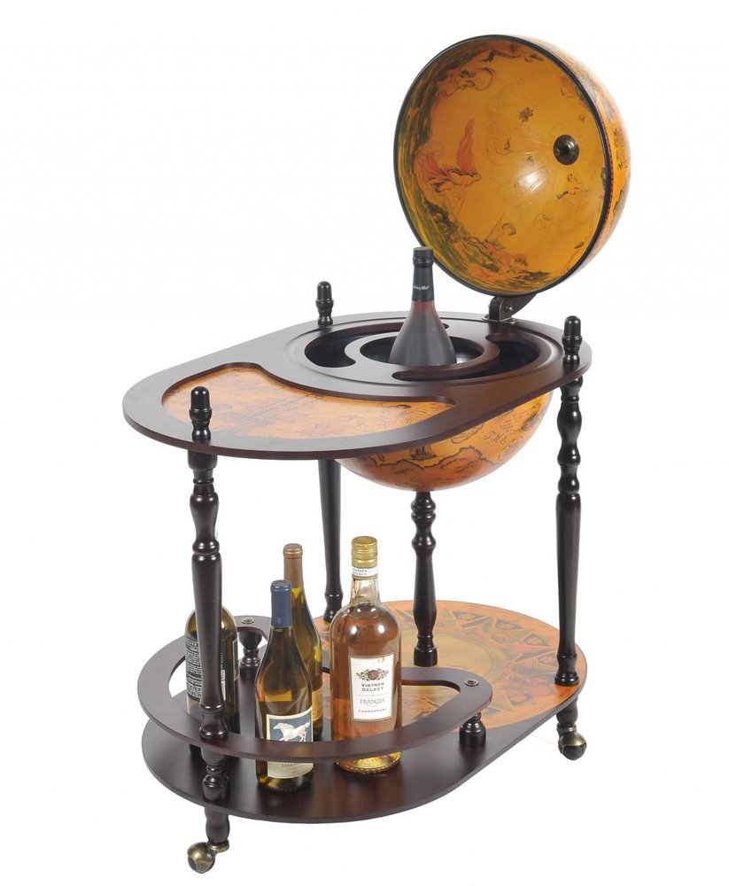 A brown solid wood oval rolling bar cart with a globe top, holding several bottles of wine, on a white background.