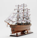 28" Brown Solid Wood Hand Painted Model Boat. Sculpture isolated on a plain white background, in a brown wood finish.
