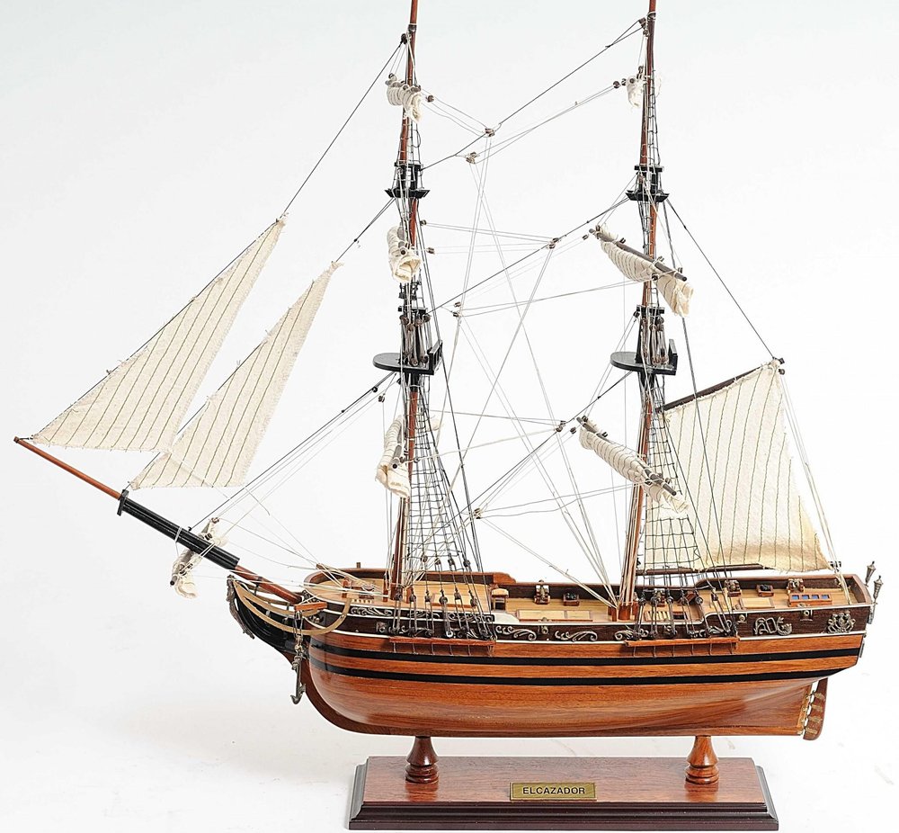 24" Brown Solid Wood Hand Painted Boat Model Boat. Home product isolated on a plain white background, finished in brown wood.