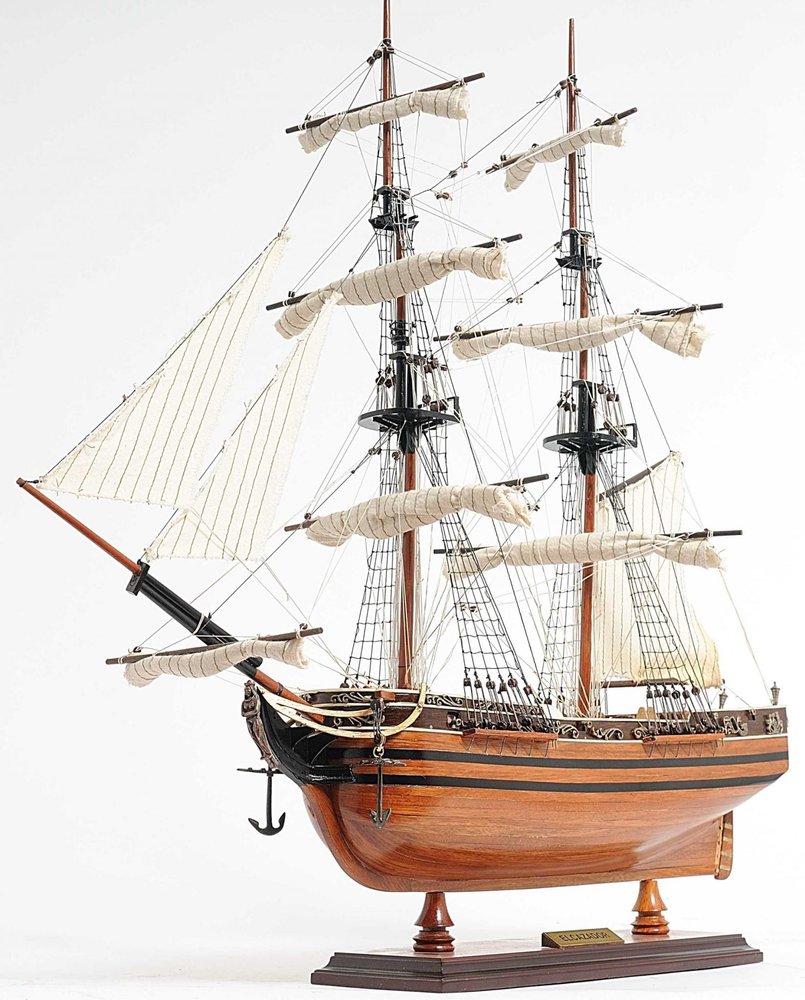 24" Brown Solid Wood Hand Painted Boat Model Boat. Home product isolated on a plain white background, in a brown wood finish.