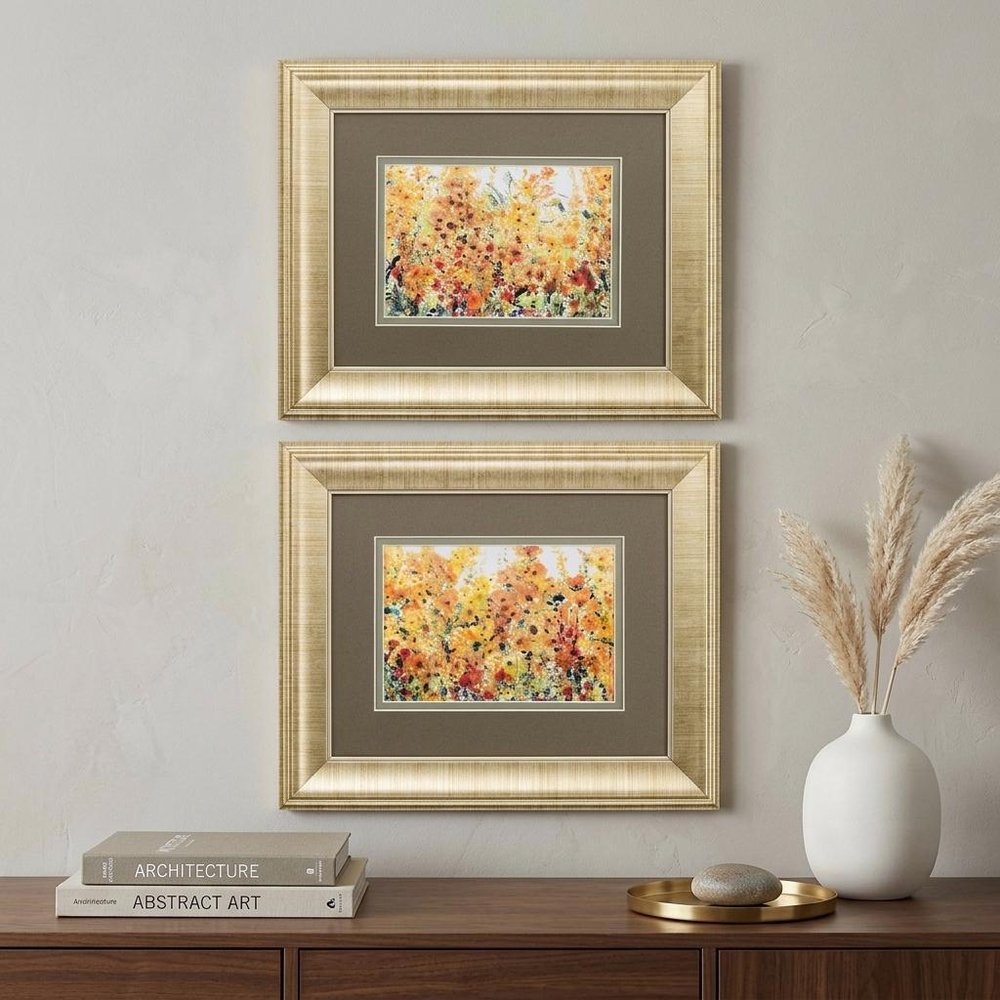 Set Of Two Pretty Summer Flowers Gold Framed Wall Art in a home interior