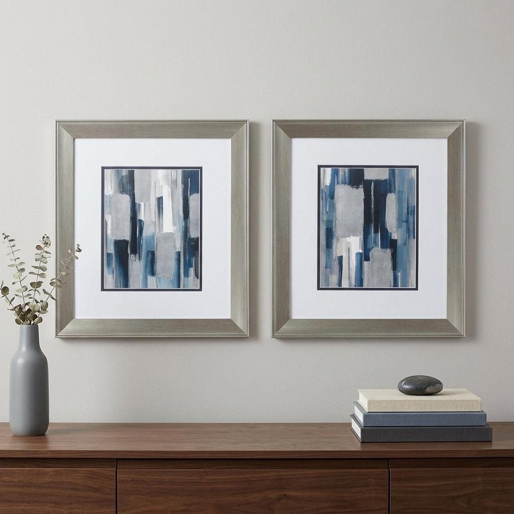 Set of Two Modern Blue Abstract Silver Framed Art in a home interior