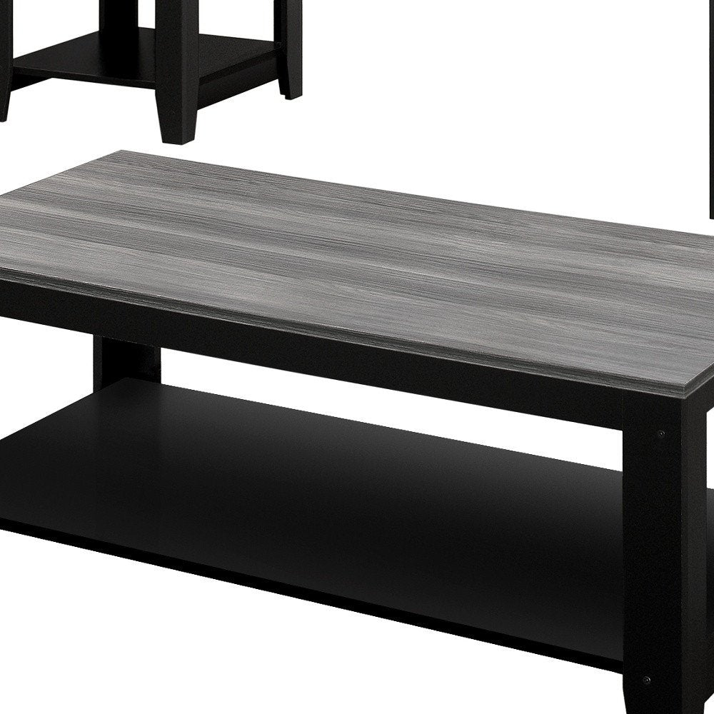Gray and black coffee table with shelf, close-up view of the tabletop and shelf.