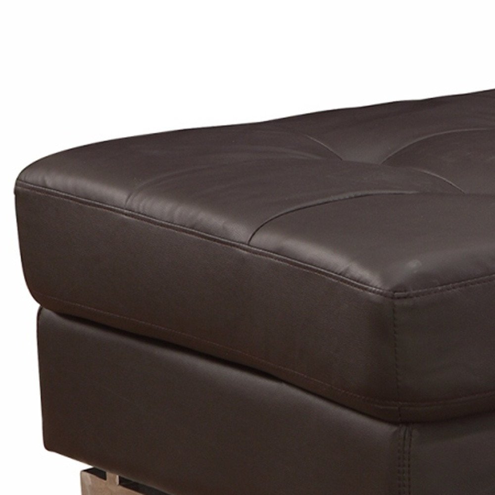 63" Brown and Silver Faux Leather Tufted Ottoman. Ottoman isolated on a plain white background, showing a brown faux leather surface.