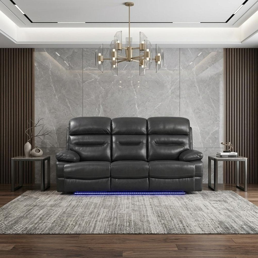 43" Grey Faux Leather Power Recliner Chair styled in a furnished interior with an off-white wall on a dark wood floor in gray faux leather.