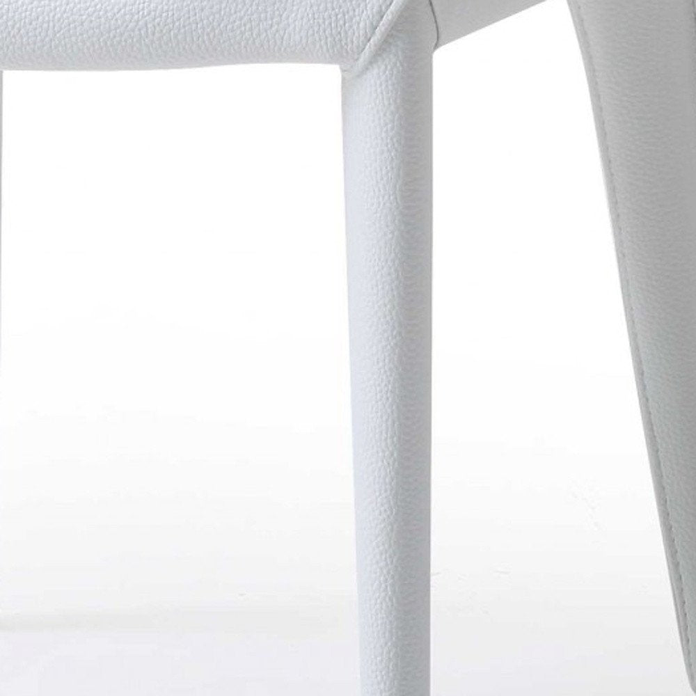 Set of Two White Slipcovered Upholstered Faux Leather Dining Side Chairs on a white background