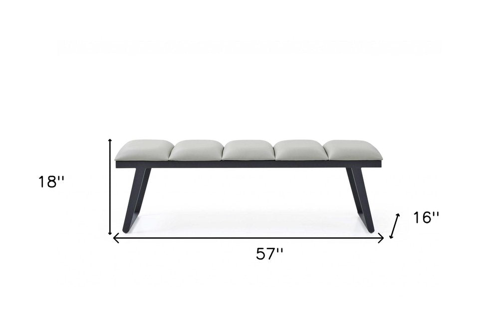 57" Light Gray and Black Upholstered Faux Leather Bench. Bench isolated on a plain white background, in a light gray faux leather finish.