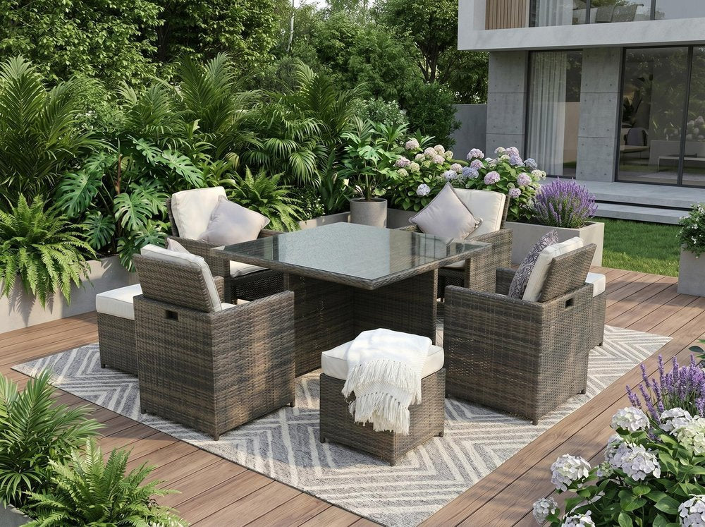 Nine Piece Clear and Gray Glass Dining Set in a home interior