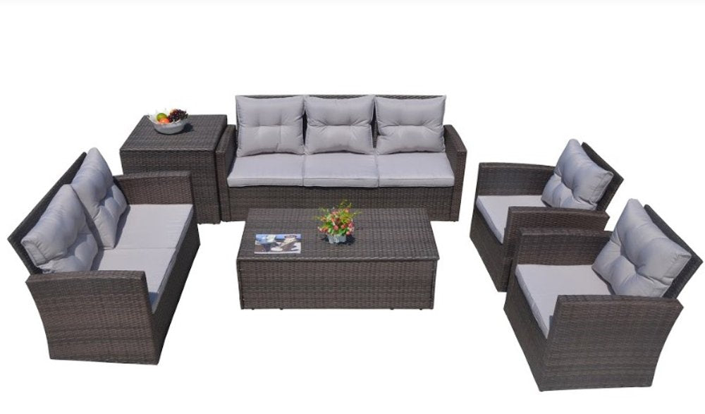 Brown wicker outdoor furniture set with grey cushions including a sofa, two chairs, a coffee table, and two side tables on a white background.