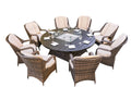 Round outdoor dining set with wicker chairs and a dark brown fire pit table with glass accents and white cushions.