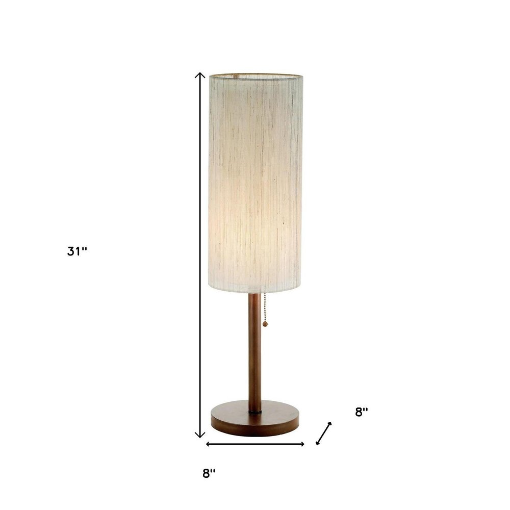 31" Walnut Solid Wood Standard Table Lamp With Beige Shade. Table lamp isolated on a plain white background, finished in beige wood.