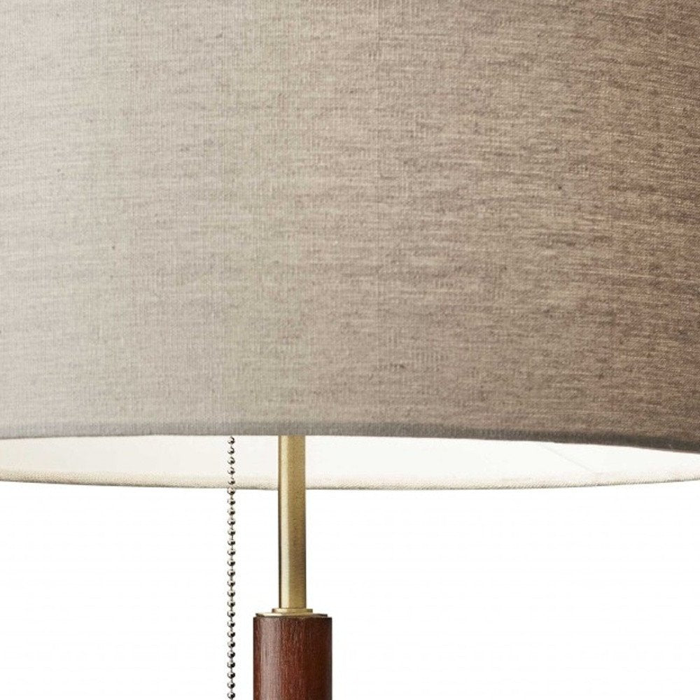 26" Antiqued Brass Solid Wood Table Lamp With Beige Drum Shade. Table lamp in beige wood.
