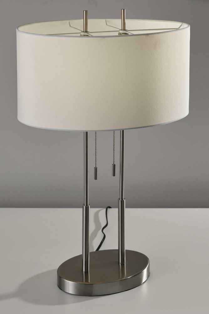 27" Silver Metal Two Light Bedside Lamp With Off White Drum Shade close-up highlighting the off-white metal surface.