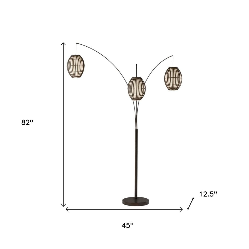 82" Bronze Three Light Tree Floor Lamp With Beige Wicker Cage Shade on a white background