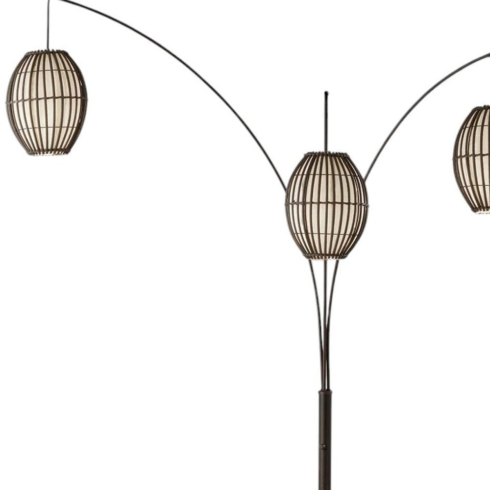 82" Bronze Three Light Tree Floor Lamp With Beige Wicker Cage Shade on a white background